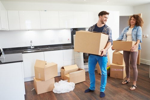 Local movers handling office furniture in a Kilburn commercial property