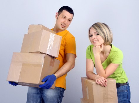 Careful loading of boxes and furniture for a move in Kilburn