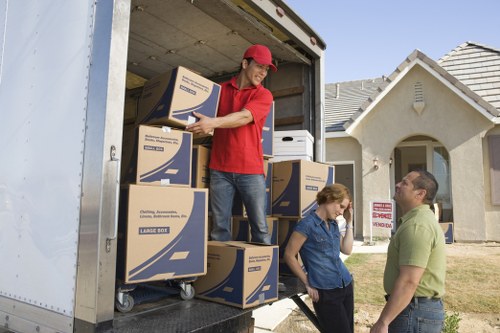 Packed business equipment ready for transport during a Kilburn move