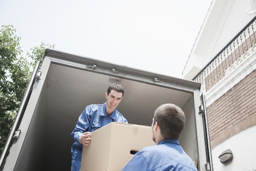 House removals equipment and boxed belongings prepared for a move in Kilburn