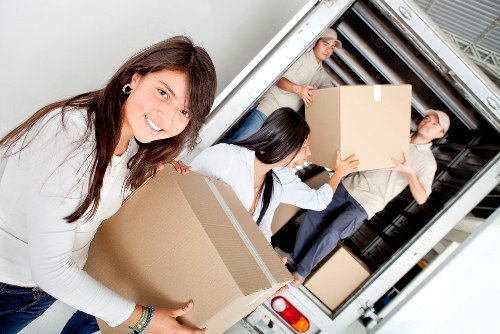 Furniture being carried carefully in a Kilburn flat move