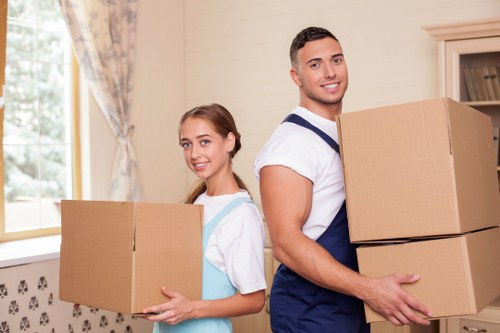 Local removal team handling boxes and furniture in Kilburn